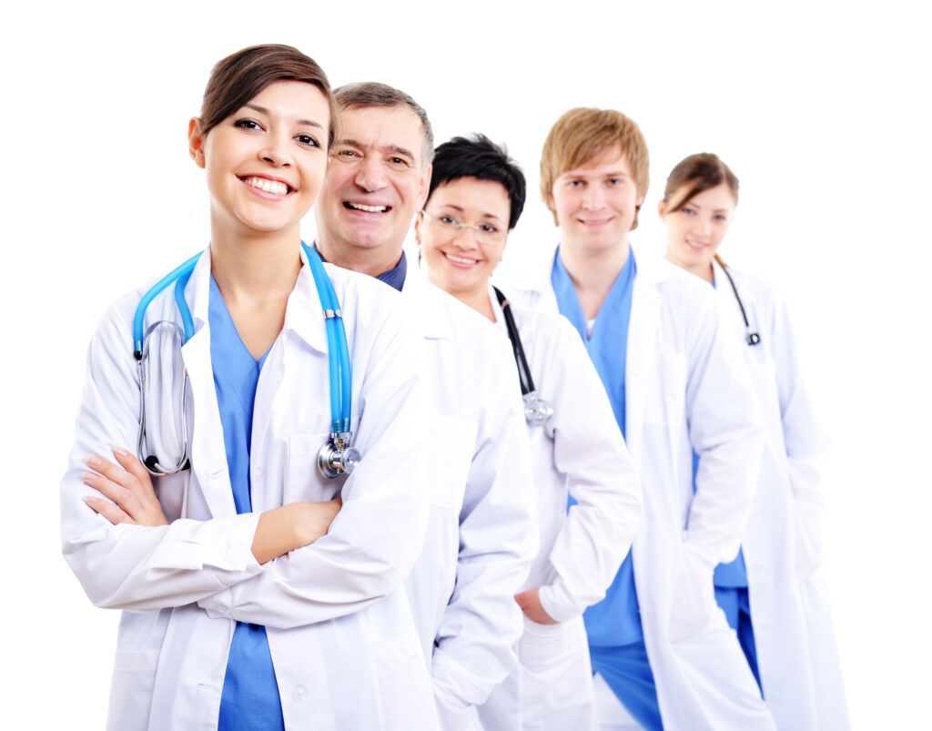 Happy doctors in hospital gowns in row